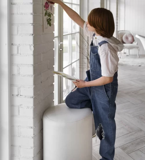 full-shot-woman-decorating-front-door