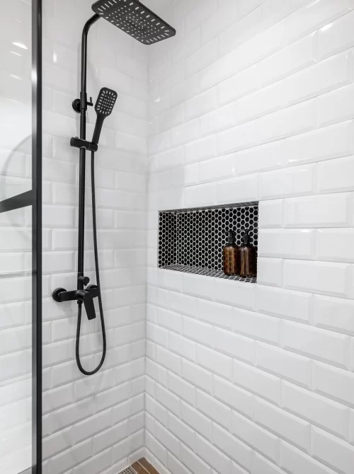 new-black-shower-head-holder-white-tiled-bathroom-modern-apartment